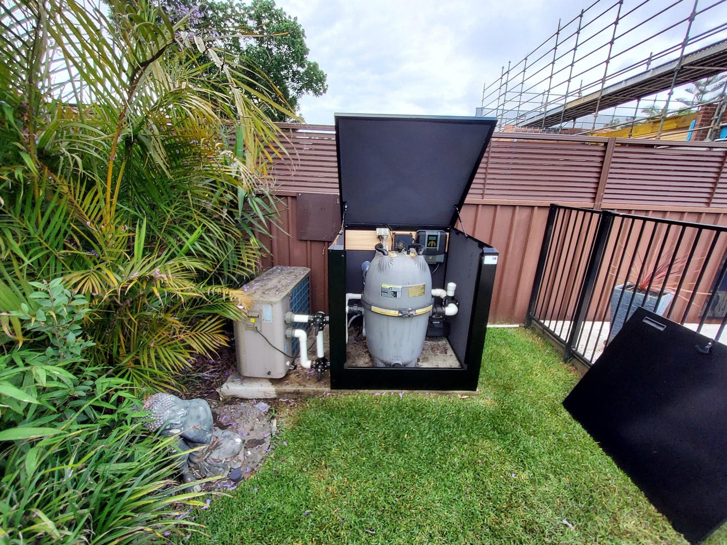 Interior of Acoustic Box brand soundproof pump enclosure with acoustic insulation panels outdoors